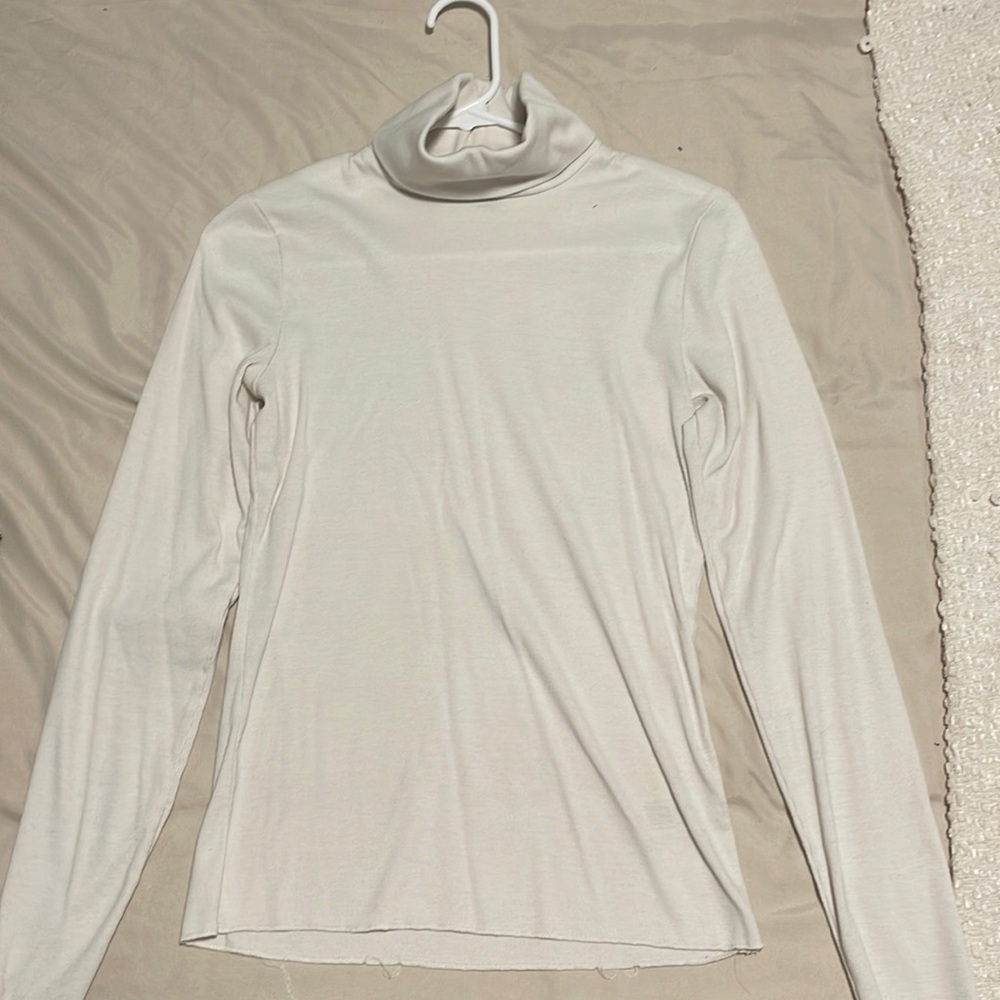 White turtle neck! Perfect for layering and a must have staple piece :)